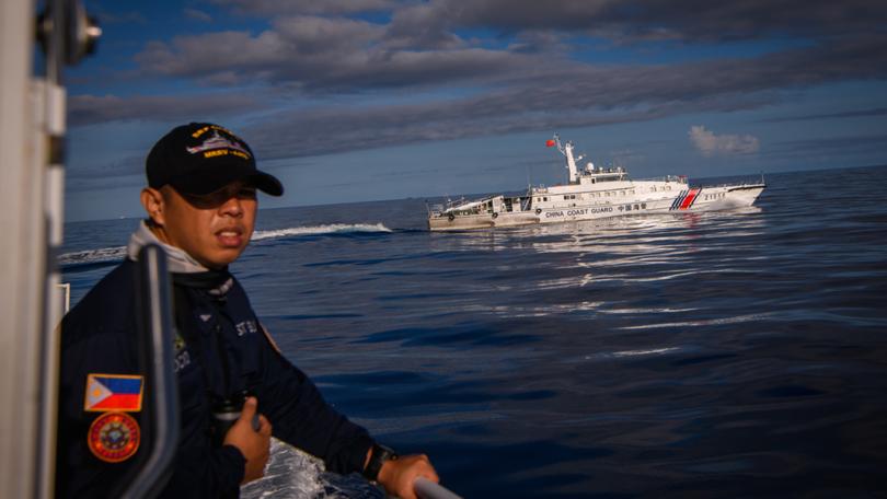 FILE — A swarm of Chinese militia and Coast Guard vessels chase a Philippine Coast Guard ship in the South China Sea, Nov. 10, 2023. As the United States prioritizes teamwork with its partners in the Asia-Pacific region, many believe they are witnessing a lasting change in American power. (Jes Aznar/The New York Times)