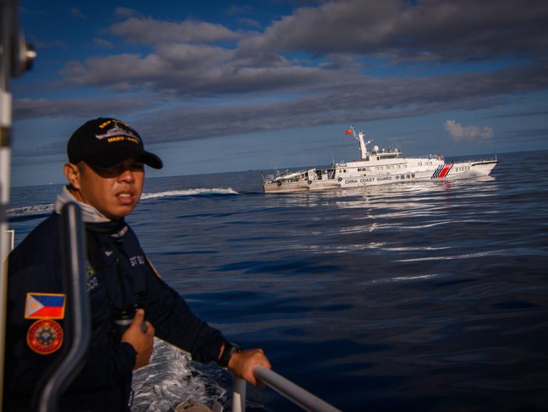 FILE — A swarm of Chinese militia and Coast Guard vessels chase a Philippine Coast Guard ship in the South China Sea, Nov. 10, 2023. As the United States prioritizes teamwork with its partners in the Asia-Pacific region, many believe they are witnessing a lasting change in American power. (Jes Aznar/The New York Times)