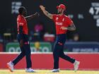 Jofra Archer of England celebrates with team mate Reece Topley during their easy win over Oman.