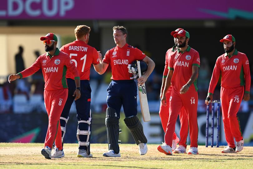 Jos Buttler and Jonny Bairstow of England celebrate victory.