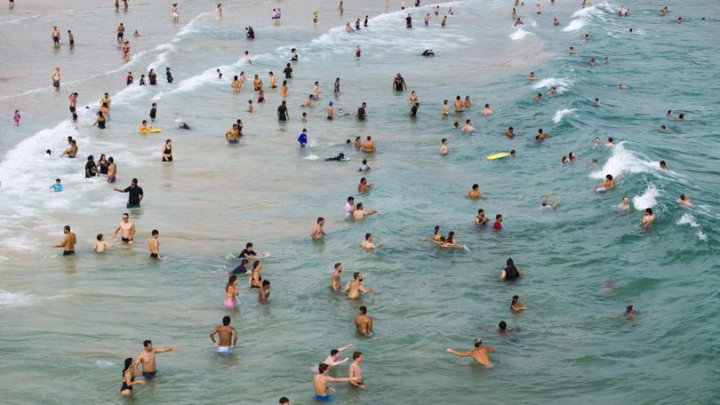 Swimmers at North Bondi Beach, near Sydney, this past January, at the height of the Australian summer. MUST CREDIT: Matthew Abbott for The Washington Post