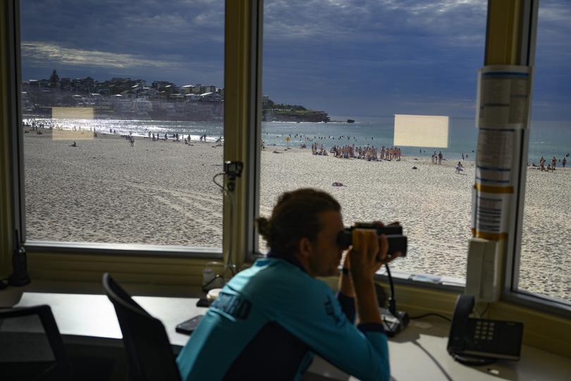 A lifeguard keeps watch from the main Bondi Beach tower on Jan. 26 — Australia Day, one of the busiest beach days of the year.  