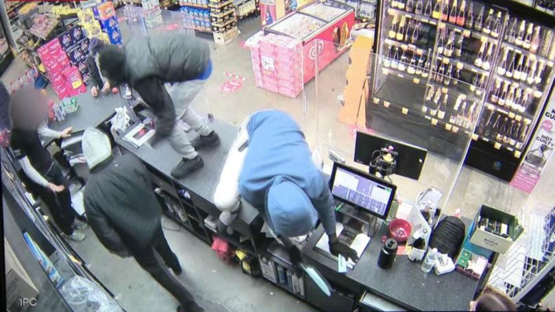 Police allege multiple shop workers were injured as the offenders, believed to be teenagers, hunted for cash and cigarettes. 