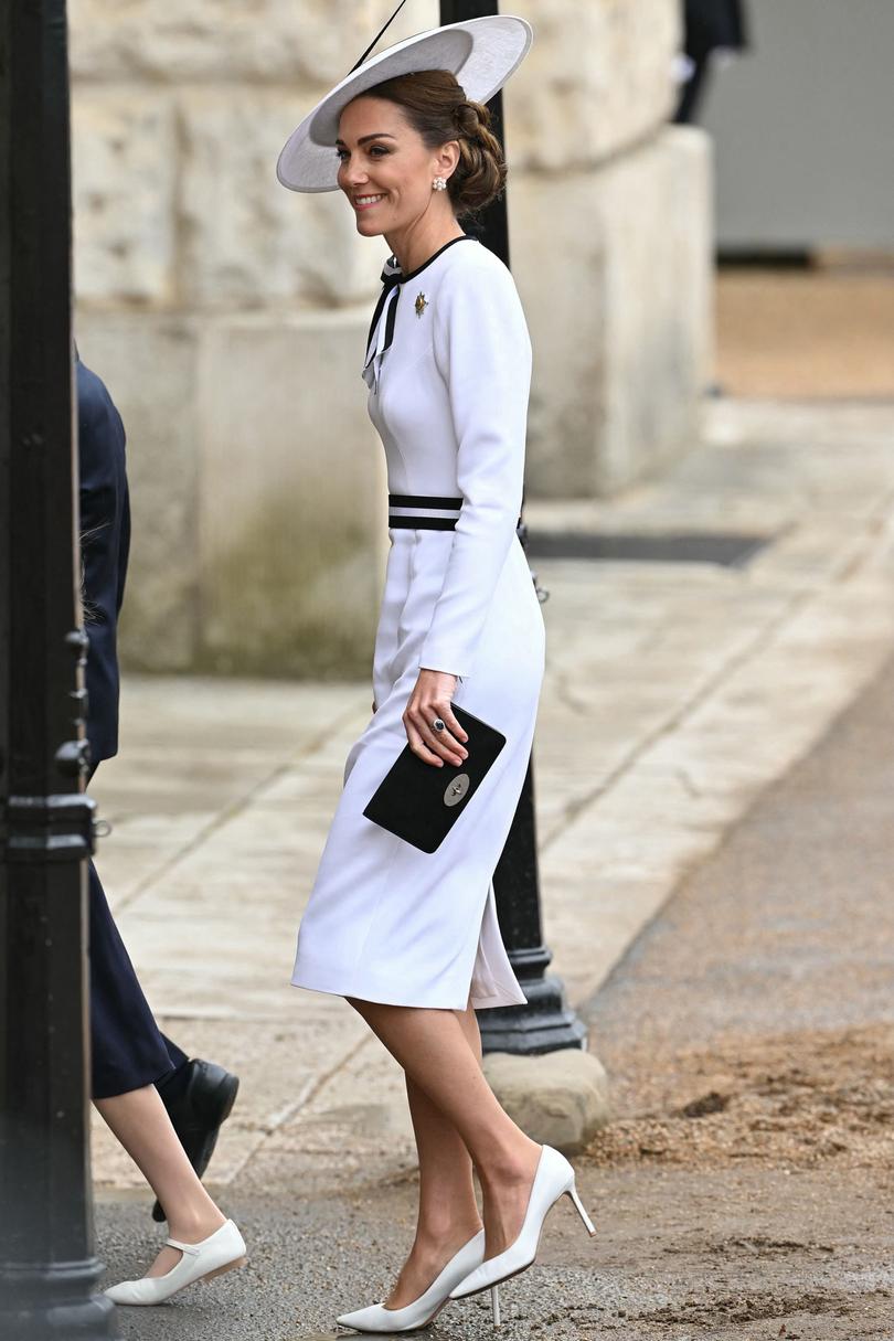 Kate’s dress is a reworked version of the dress she wore to a coronation lunch at Buckingham Palace last year. She owns the same dress in navy and black, too. 