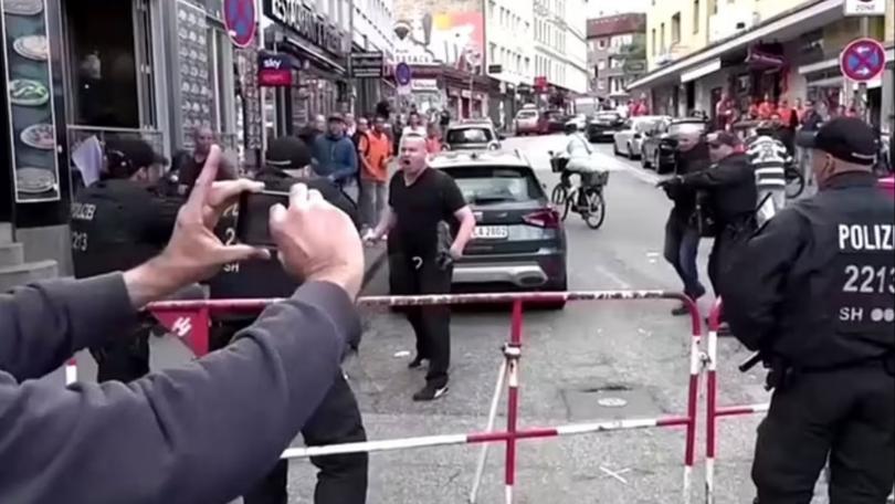 Police have neutralised a suspect with a hammer and a molotov cocktail near a fan complex at the famous Reeperbahn in Hamburg.