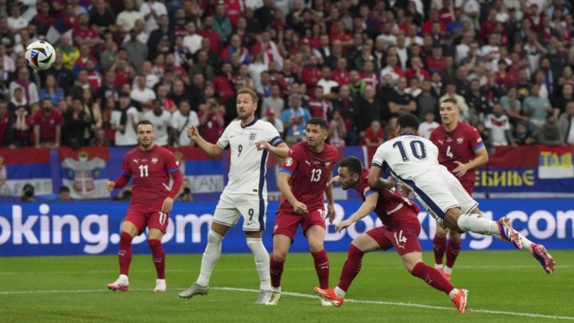 England's Jude Bellingham (10) heads home the only goal of the game to defeat Serbia.