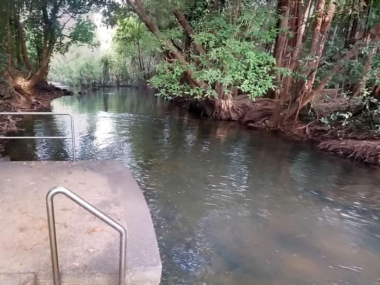 A man has drowned at a popular swimming spot near Darwin.