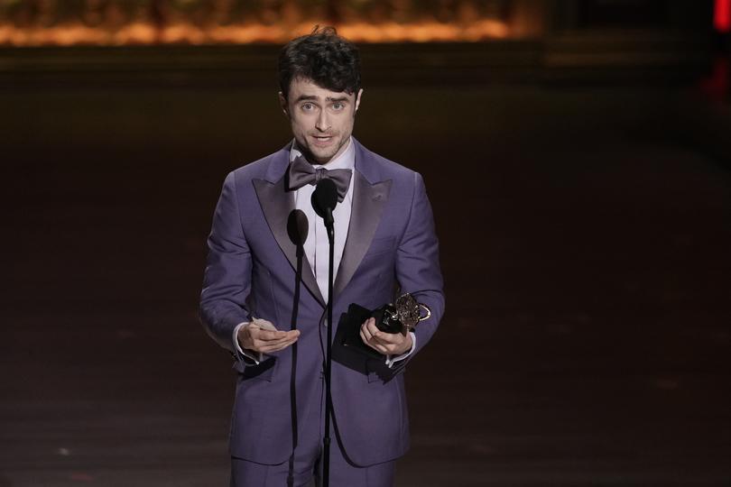 Daniel Radcliffe accepts the award for best performance by an actor in a featured role in a musical for Merrily We Roll Along.