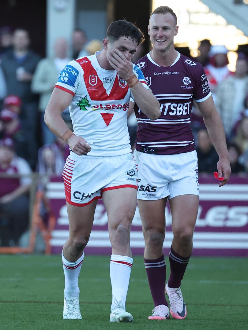 SYDNEY, AUSTRALIA - JUNE 16: Kyle Flanagan of the Dragons walks off for HIA assessment as Daly Cherry-Evans of the Sea Eagles exchanges pleasantries during the round 15 NRL match between Manly Sea Eagles and St George Illawarra Dragons at 4 Pines Park, on June 16, 2024, in Sydney, Australia. (Photo by Jeremy Ng/Getty Images)