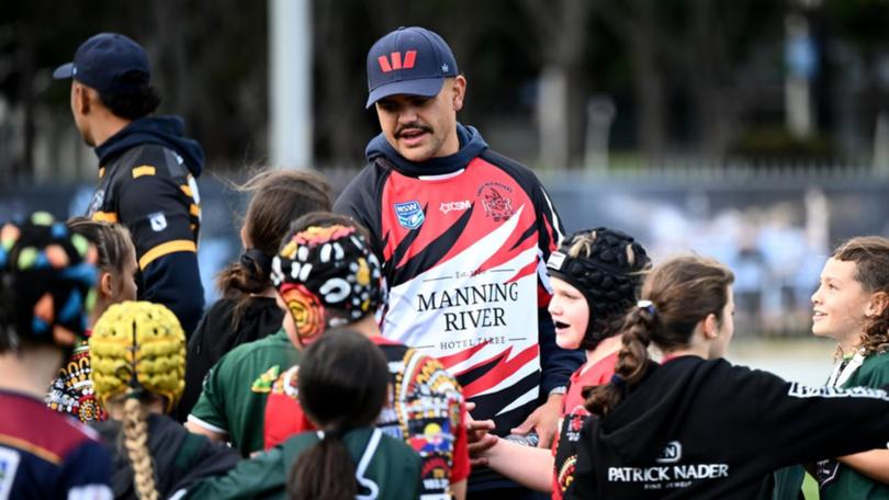 Recalled NSW star Latrell Mitchell was a centre of attention for kids on Monday. (Bianca De Marchi/AAP PHOTOS)