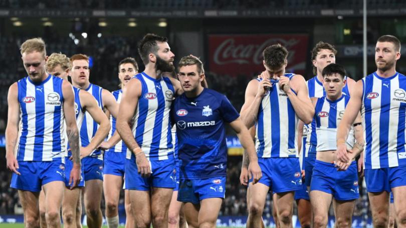 North Melbourne players were devastated after their one-point loss to Collingwood. (Joel Carrett/AAP PHOTOS)