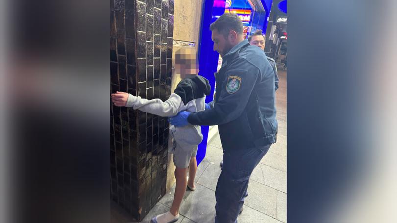 Confronting photographs have emerged of three children in police custody.