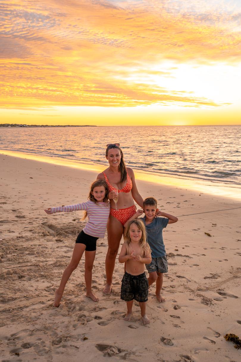 Amy with Elsie, Henry and Ralph at the beach.