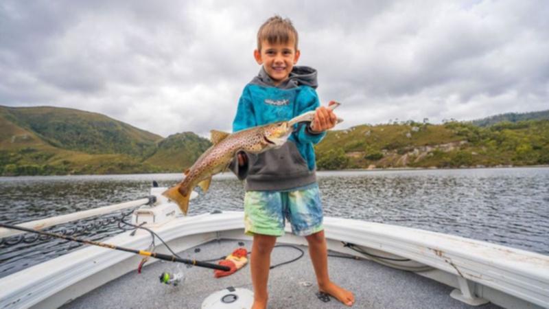 Henry with a fish he helped catch.