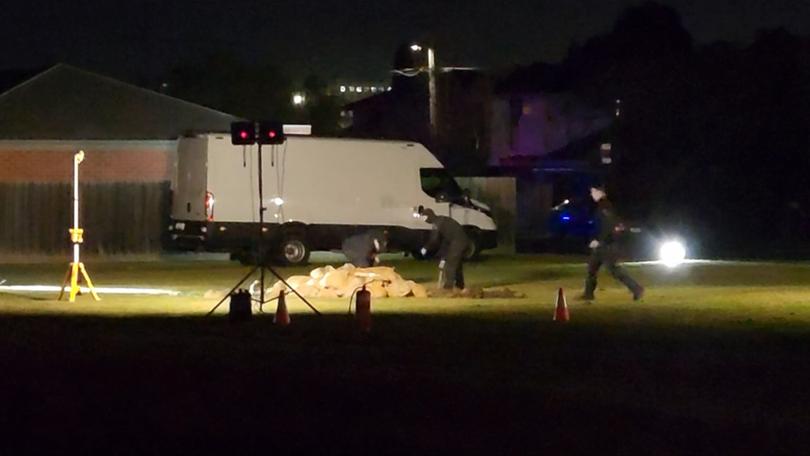 Several sandbags were set up in a park across the street of a North Shore address where police executed a search warrant.