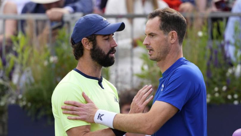 Jordan Thompson (left) commiserated with Andy Murray over his injury withdrawal at Queen's Club.