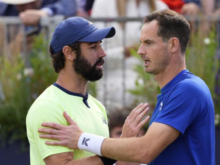 Jordan Thompson (left) commiserated with Andy Murray over his injury withdrawal at Queen's Club.