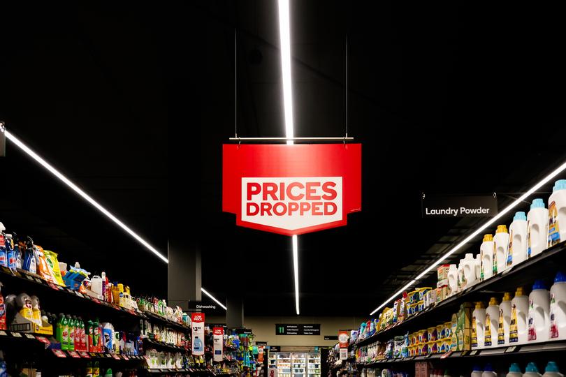 MELBOURNE, AUSTRALIA - MARCH 19: A prices dropped sign at a Woolworths supermarket on March 19, 2024 in Melbourne, Australia. Australia's two major supermarket chains, Coles and Woolworths, have come under scrutiny for their role in the cost of living crisis in the country, with both companies significantly increasing their profits during the pandemic while consumers faced rising living costs, local media reports said. Former cabinet minister Craig Emerson is leading a government inquiry into supermarket pricing practices, while former ACCC chair Allan Fels is conducting a separate investigation in collaboration with the Australian Council of Trade, ABC News said. (Photo by Asanka Ratnayake/Getty Images)