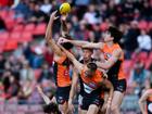 Sam Taylor (right) was injured during the Giants' win over Port Adelaide in Sydney.  (Steven Markham/AAP PHOTOS)