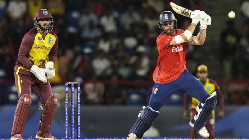 England opening batter Phil Salt (right) took the attack up to the West Indies bowlers.  (AP PHOTO)