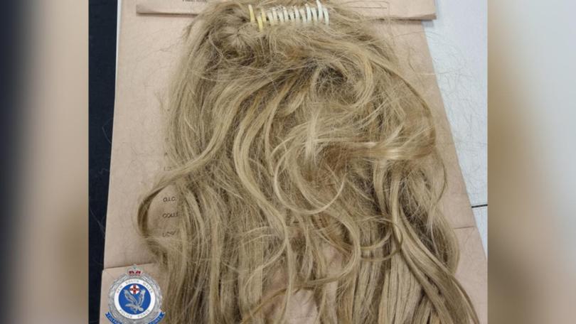 A man has been charged over stealing TVs from a Sydney hotel while disguised with a wig. (HANDOUT/NSW POLICE)