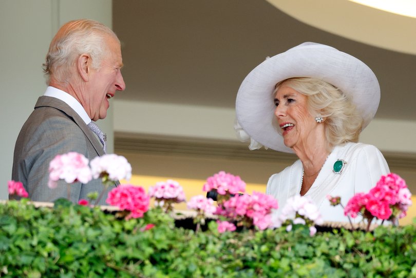 King Charles III and Queen Camilla watch, from the Royal Box, their horse 'Gilded Water' run, and finish 12th, in the King George V Stakes on day three 'Ladies Day'.