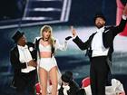 Taylor Swift is joined on stage by Travis Kelce (R), during "Taylor Swift | The Eras Tour" at Wembley Stadium on June 22, 2024 in London, England. (