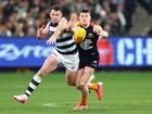  Patrick Dangerfield contests the ball with Sam Walsh