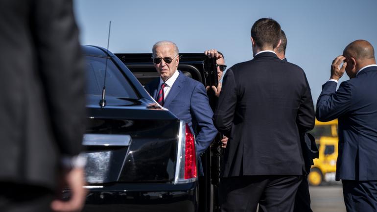 President Joe Biden stops to listen to a shouted question from the press after arriving at Seattle-Tacoma International Airport.