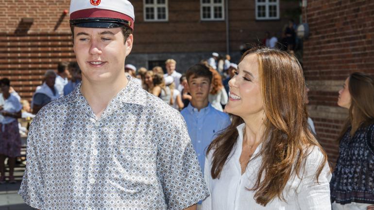 Crown Prince Christian and Queen Mary meet the press as the royal teen attends his graduation ceremony at Ordrup Gymnasium on Monday.