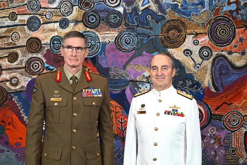 Current Chief of the Australian Defence Force General Angus Campbell (left) and incoming Chief of the Australian Defence Force Vice Admiral David Johnston pose for photographs at the Russell buildings in Canberra, Tuesday, April 9, 2024. (AAP Image/Lukas Coch) NO ARCHIVING