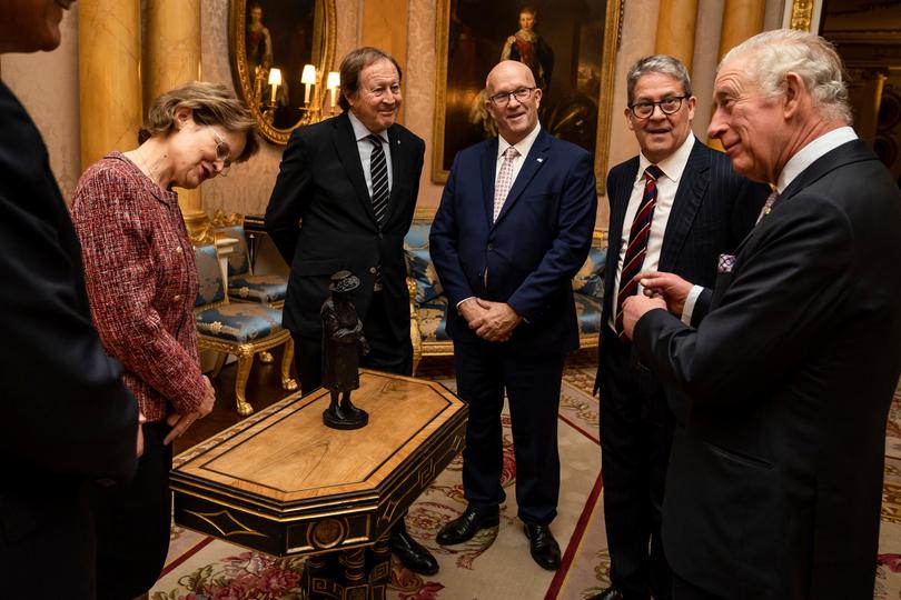 Bill Muirhead, second from left, watches on as Britain's King Charles III is presented with a maquette of Queen Elizabeth II by the Governor of South Australia Frances Adamson, Rod Bunten, serving agent General of South Australia David Ridgway and Peter Flavel at Buckingham Palace in 2022.