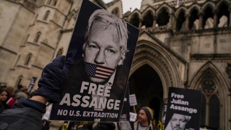 Julian Assange was charged with conspiracy to obtain and disclose national defence information. (AP PHOTO)