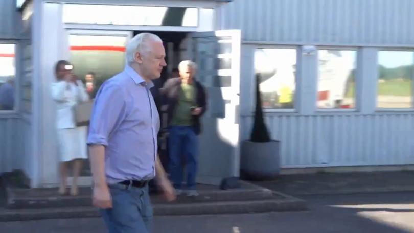 WikiLeaks Founder Julian Assange boards a plane after being released from prison.