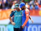 David Warner and Virat Kohli embrace following India’s win over Australia.