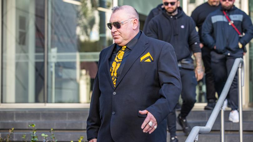 Karl Labrook exits Perth Magistrates Court on Monday morning after being found guilty, wearing Comancheros colours.