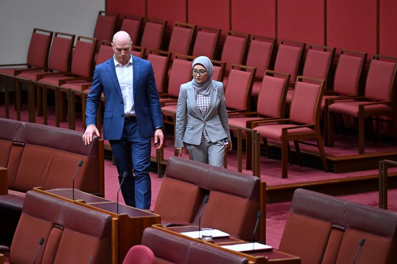 Labor Senator Fatima Payman (right) walks with Independent Senator David Pocock as she crosses the floor to a motion moved by the Australian Greens to recognize the State of Palestine during debate in the Senate chamber at Parliament House in Canberra, Tuesday, June 25, 2024. (AAP Image/Lukas Coch) NO ARCHIVING