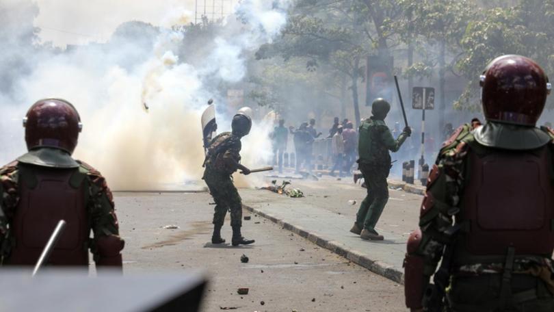 Anti-riot police have used tear gas, water cannons and guns to quell violent protests in Kenya. 