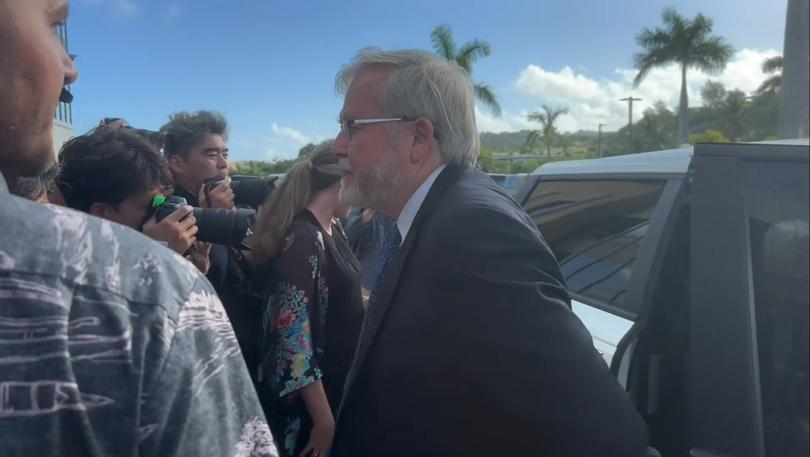 Jullian Assange has arrived at a Saipan court ahead of a plea deal that will see the Australian return home.