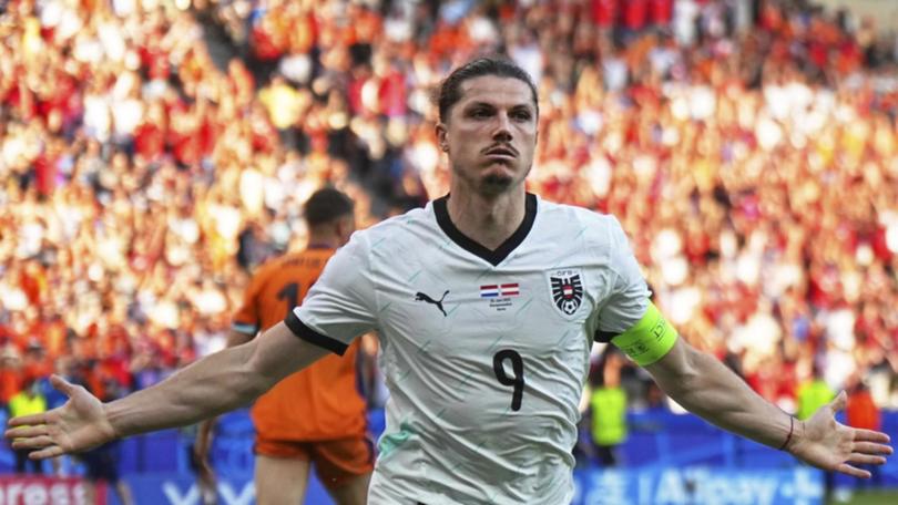 Austria's Marcel Sabitzer celebrates after scoring his side's third goal against the Netherlands.