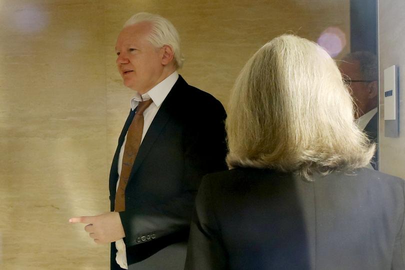 SAIPAN, NORTHERN MARIANA ISLANDS - JUNE 26: WikiLeaks founder Julian Assange is seen through a glass window following his arrival at the United States Courthouse where he is expected to enter a guilty plea to an espionage charge ahead of his expected release on June 26, 2024 in Saipan, Northern Mariana Islands. Julian Assange, the WikiLeaks founder, was to appear before the U.S. District Court for the Northern Mariana Islands in Saipan on Wednesday for a change of plea hearing. Following his expected guilty plea to a felony charge under the Espionage Act, Assange is anticipated to be sentenced to time served and subsequently released, paving the way for his return to Australia after years of incarceration. (Photo by Chung Sung-Jun/Getty Images)