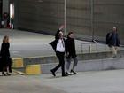 WikiLeaks founder Julian Assange waves as he arrives at Canberra Airport.
