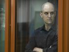 Evan Gershkovich appeared in a glass box with his head shaved during his court appearance.
