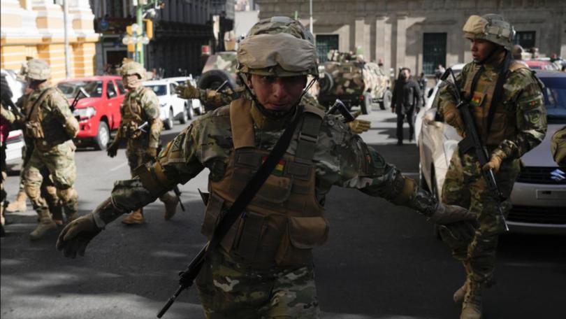 Heavily armed soldiers have gathered in an area of the Bolivian capital La Paz. (AP PHOTO)