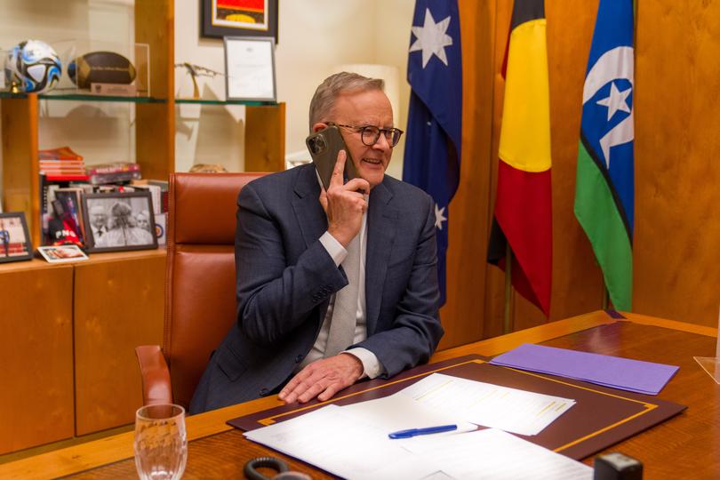 Anthony Albanese talks to Julian Assange as he lands in Australia