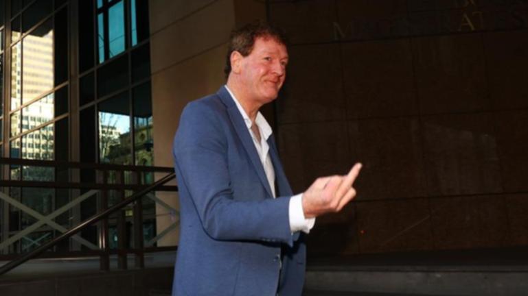Former AFL player agent Ricky Nixon gave the media the middle finger as he entered the court. (Con Chronis/AAP PHOTOS)