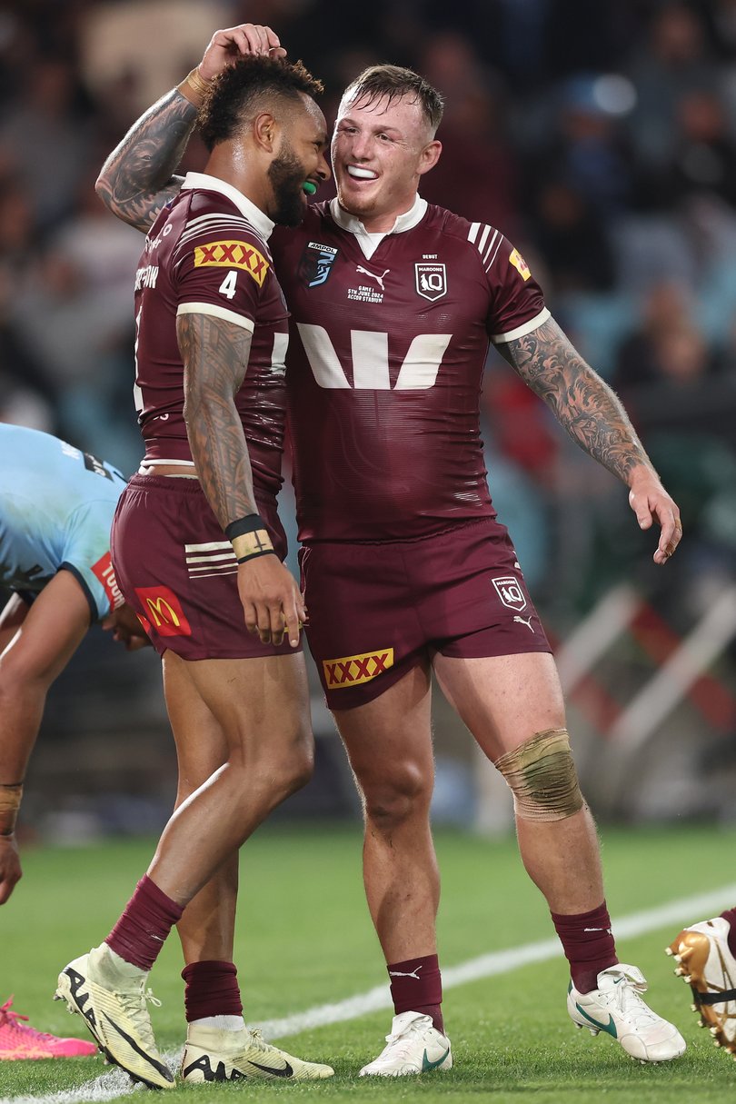 SYDNEY, AUSTRALIA - JUNE 05: Hamiso Tabuai-Fidow (L)of the Maroons celebrates with J'maine Hopgood of the Maroons after scoring his third try during game one of the 2024 Men's State of Origin Series between New South Wales Blues and Queensland Maroons at Accor Stadium on June 05, 2024 in Sydney, Australia. (Photo by Matt King/Getty Images)