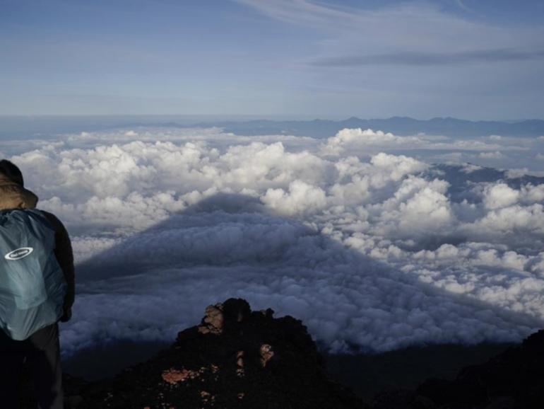 Cold temperatures and altitude sickness are risks for the thousands who scale Mount Fuji every year. (AP PHOTO)