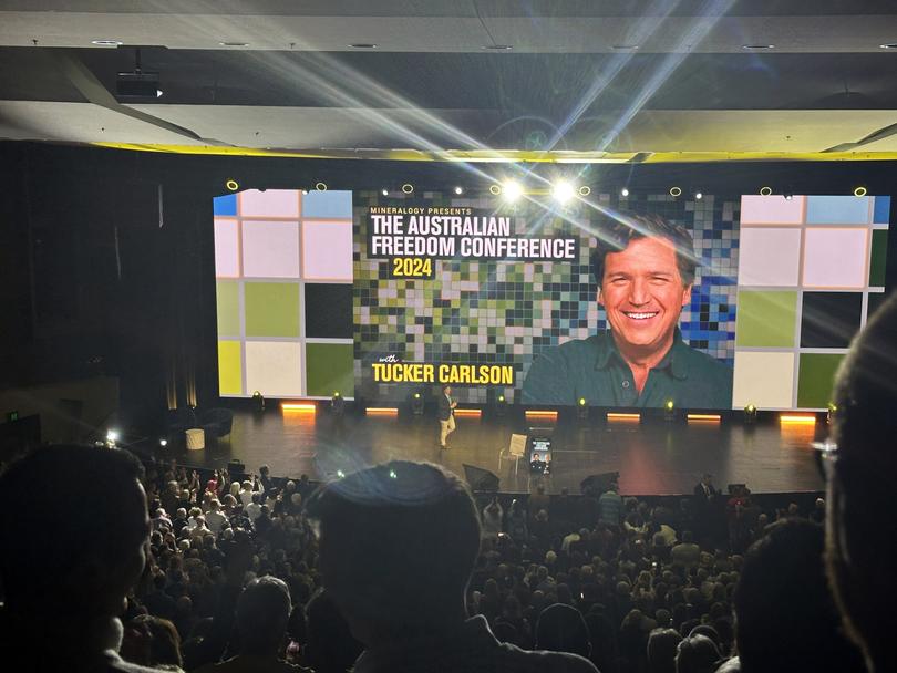 It was billed as the Tucker Carlson and Clive Palmer Freedom Tour, but fifty per cent of the top-billed act failed to show up at Monday night?s event in Perth.