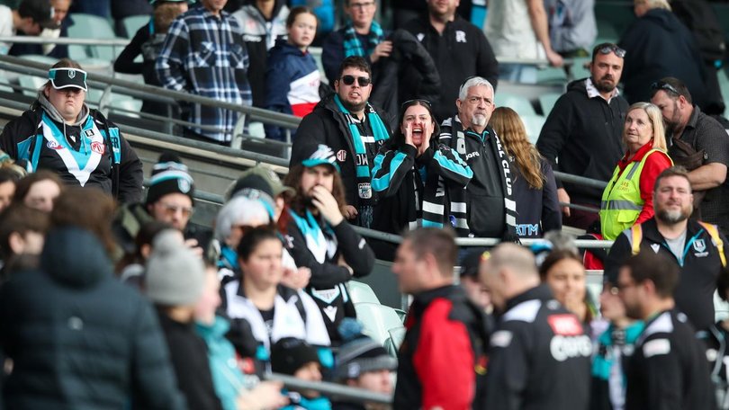 Port fans give head coach Ken Hinkley some advice as he leaves the field after the Brisbane loss.  (Matt Turner/AAP PHOTOS)